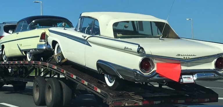 Classic cars on transport truck
