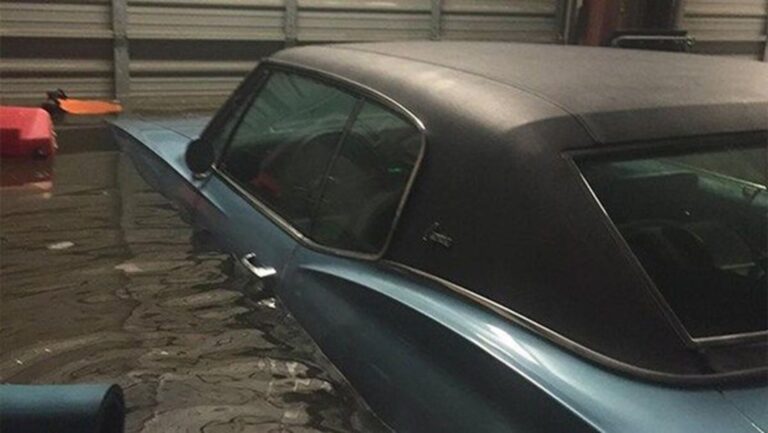 Blue car in flooded garage