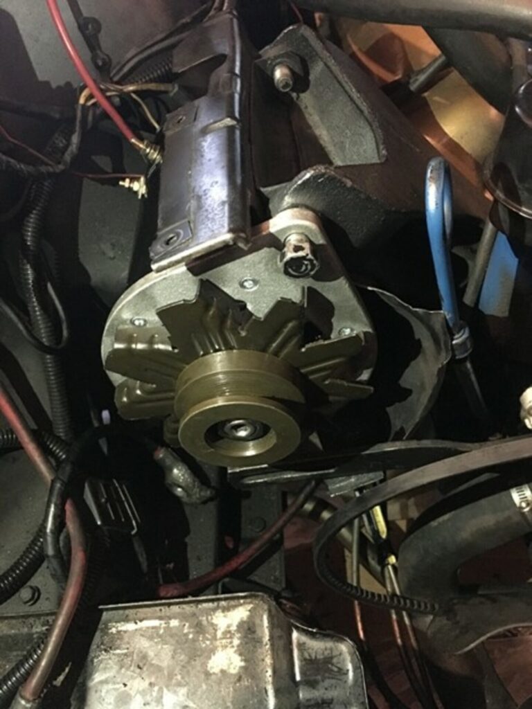 Classic car generator on engine