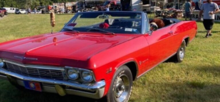 Red 1965 Impala for sale at swap meet