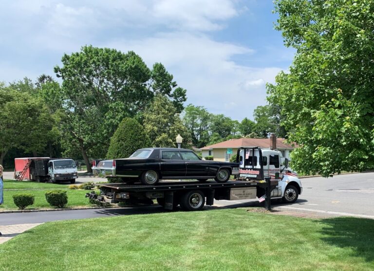 Cadillac leaving on flatbed