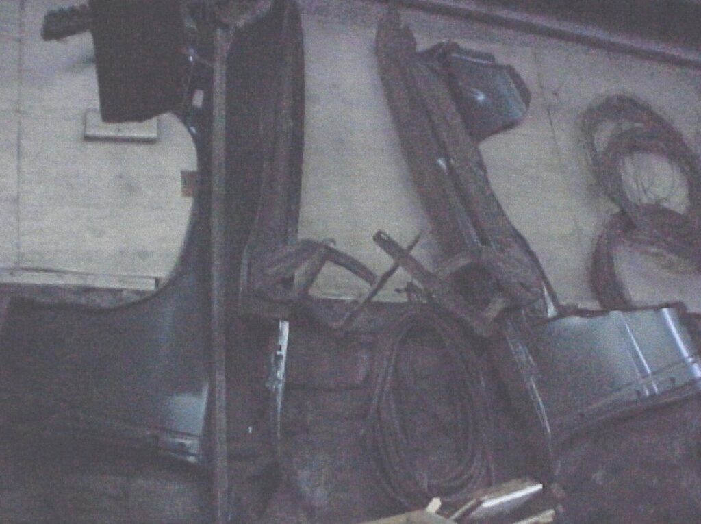 Chevelle fender parts hanging on a wall