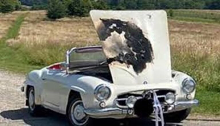 Fire damaged white Mercedes convertible
