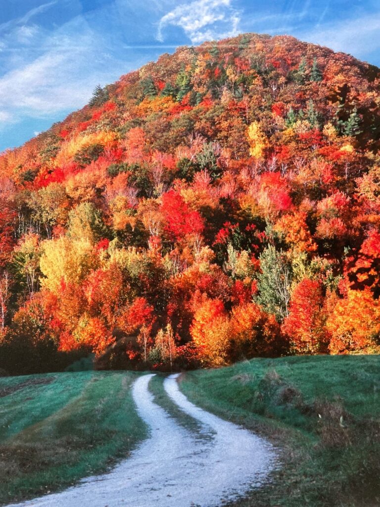 Vermont mountain with dirt road a regional fall road trip