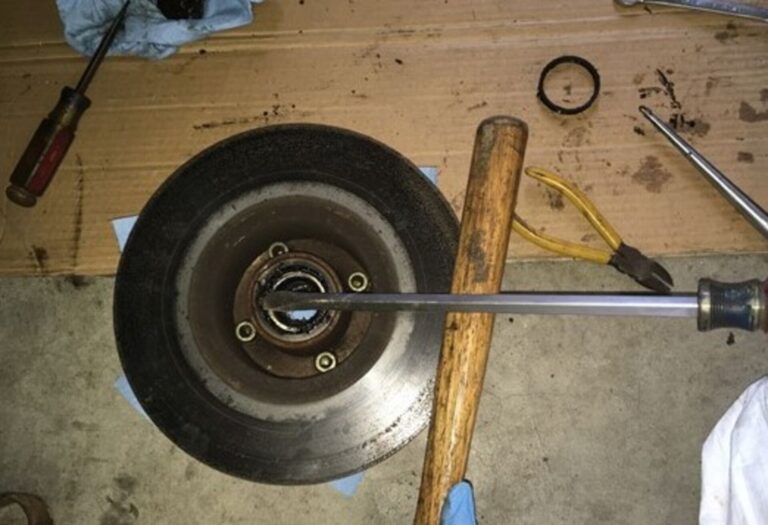 Prying wheel bearing from rear of hub