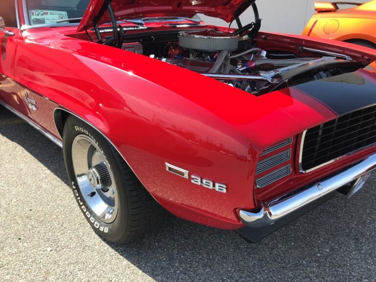 Front of red Camaro with hood open
