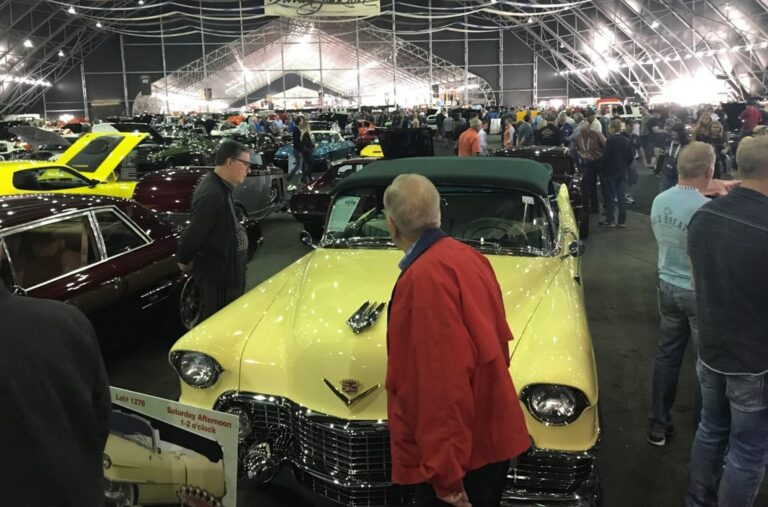 Classic car auction with yellow car