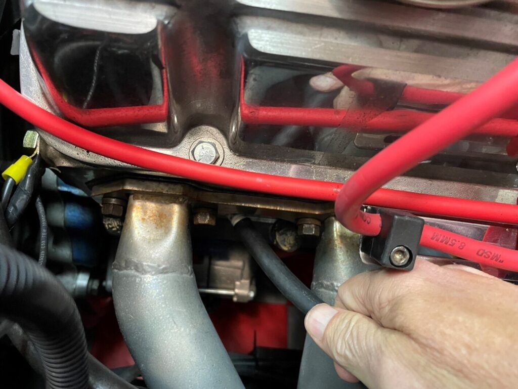 Using rubber fuel line to install a spark plug