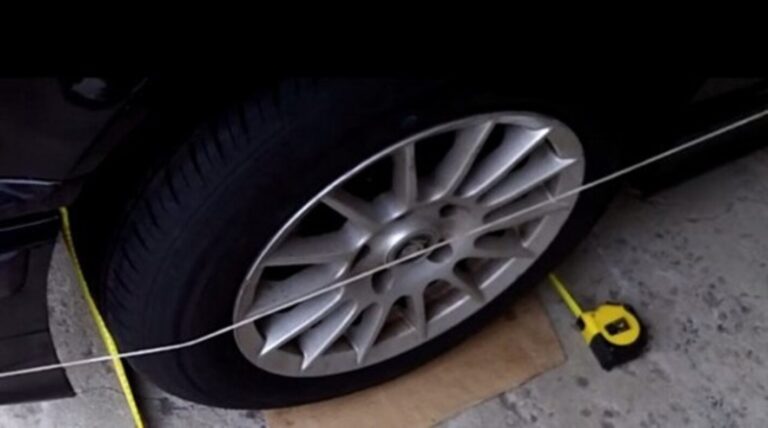 Wheeel with string and measuring tape to adjust alignment