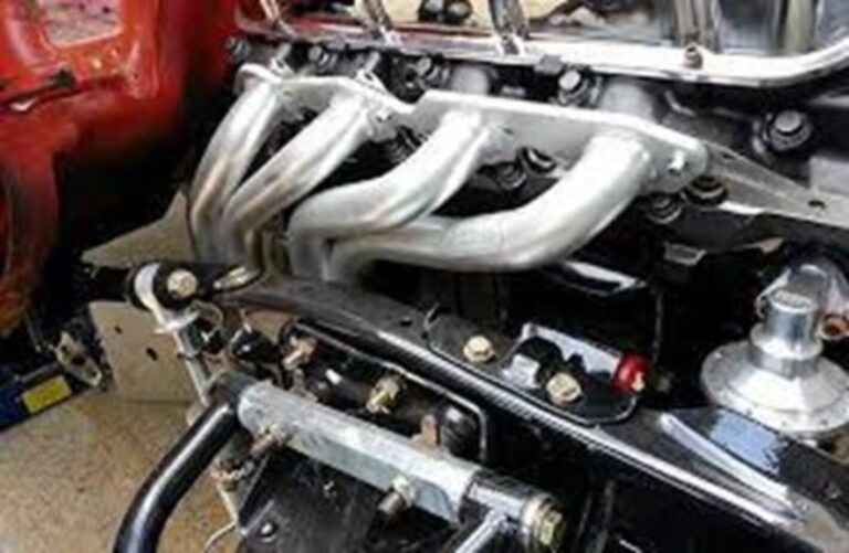 Ceramic coated Chevrolet car headers mounted on an engine