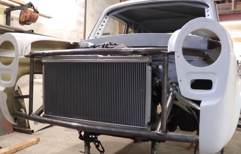 Front view of radiator support with radiator installed in a classic car