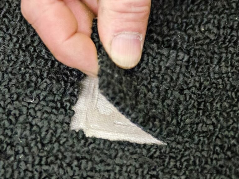 Installing carpet repair patch into car carpet