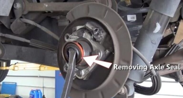 Removing the rear differential axle seal with prybar