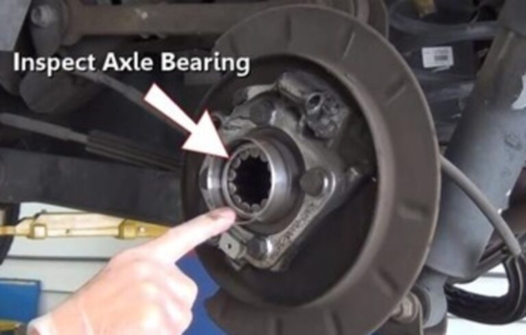 Inspecting rear differential axel bearing installation