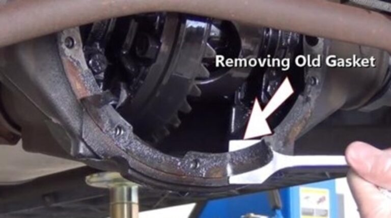 Scraping the old gasket off the rear differential