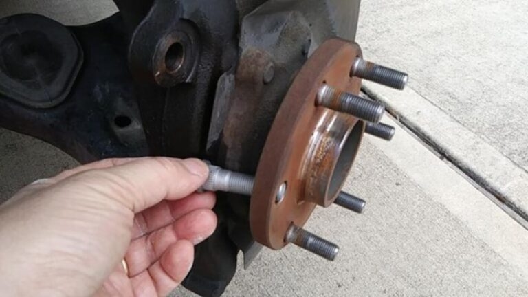Placing a new wheel stud into the wheel hub