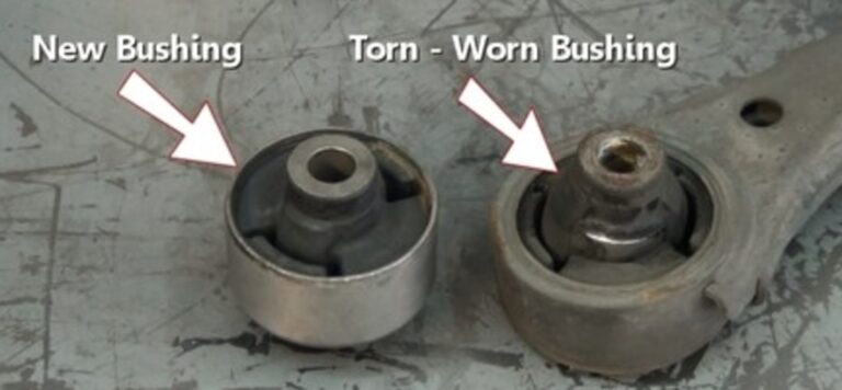 A new suspension bushing next to worn bushing in a control arm