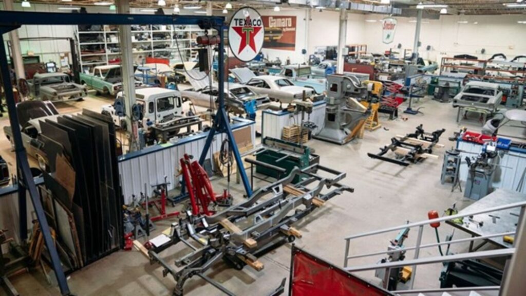 A view of the inside of a classic car restoration shop