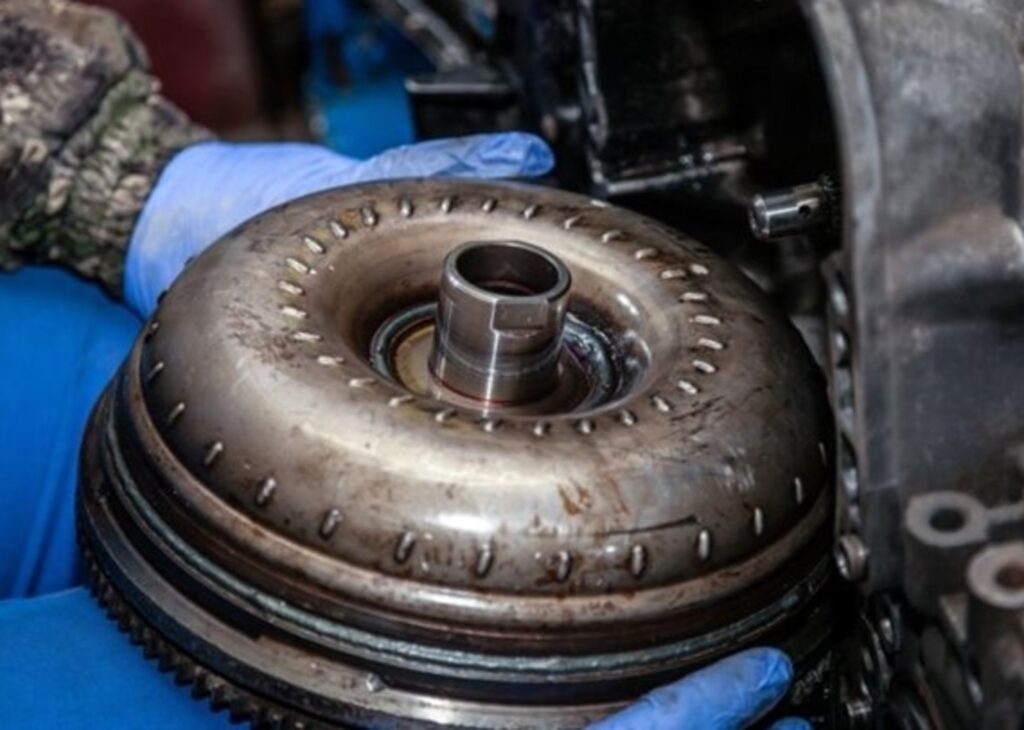 Holding a transmission torque converter