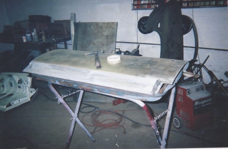 Sheet metal repair work being done on a Chevelle door