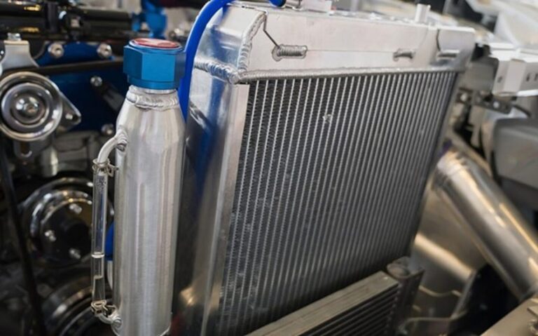 Engine oil cooler and catch can