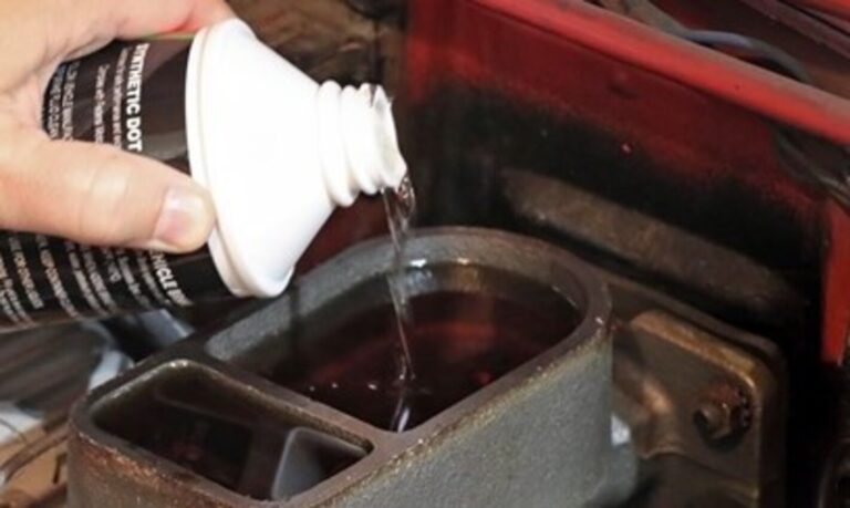 Pouring brake fluid into a master cylinder during a brake fluid flush