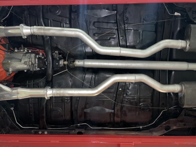 Underside of 68 Chevelle showing floor pans, exhaust, drive shaft plumbing and transmission