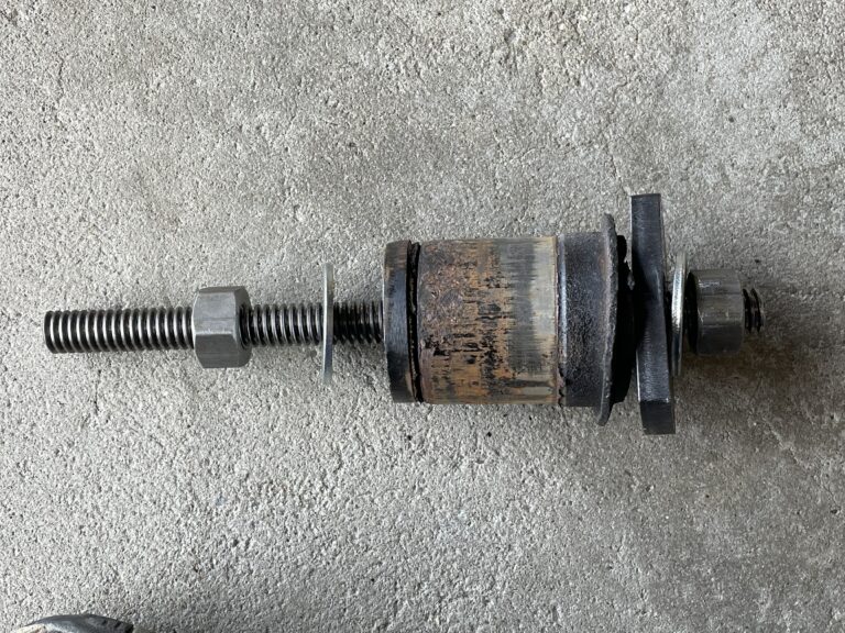 An assembled bearing replacement tool assembled with an old bearing as an example