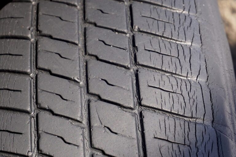 Radial tire with uneven wear and spalling treadn
