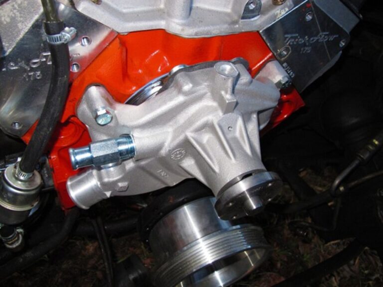 A Chevy big block engine with freshly installed water pump rebuilding
