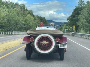 Roll Royce driving on country road in Vermont