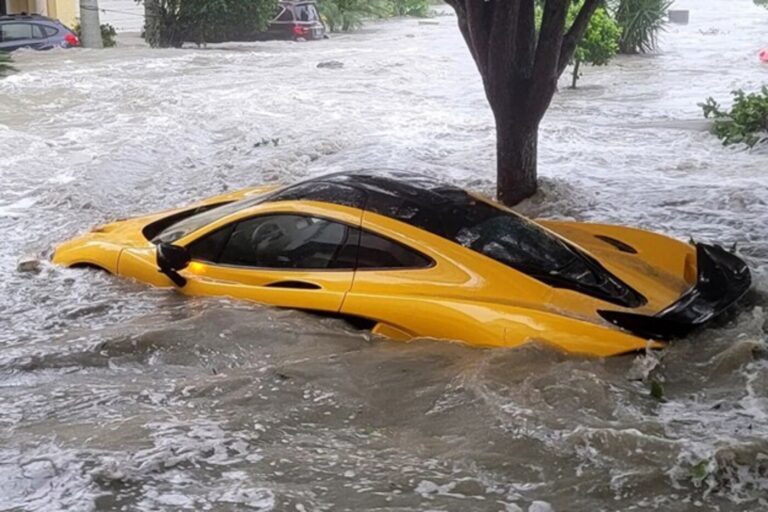 Yellow McClaren under flood water from Hurricane Ian in Florida