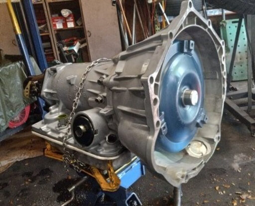 A car automatic transmission on a jack under a car