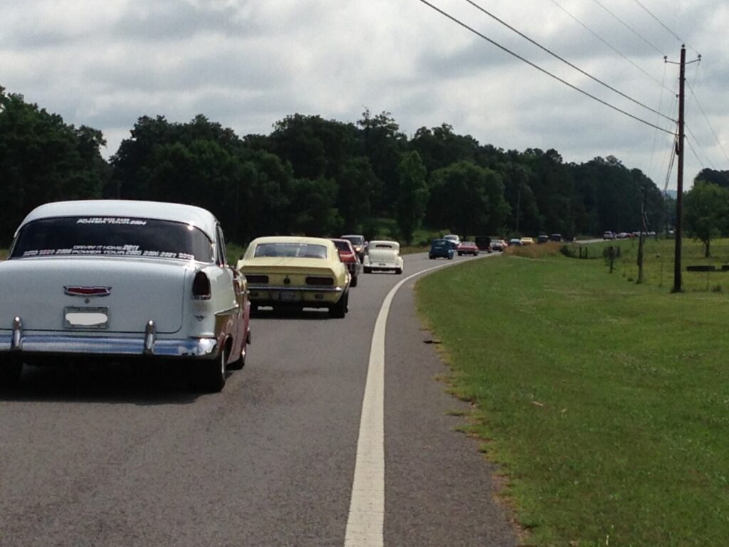 Classic Chevy's on road trips with a white Belair, yellow Camaro, red Chevelle and white 34 Coupe