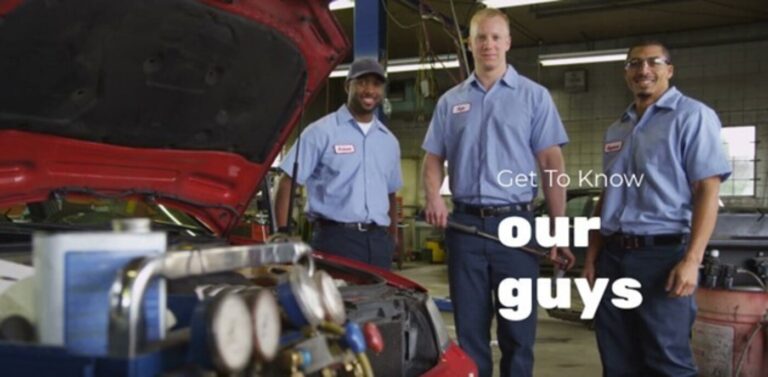 3 car mechanics with light blue shirt and dark blue pants working in a car repair shop with the wording of Get to know our guys