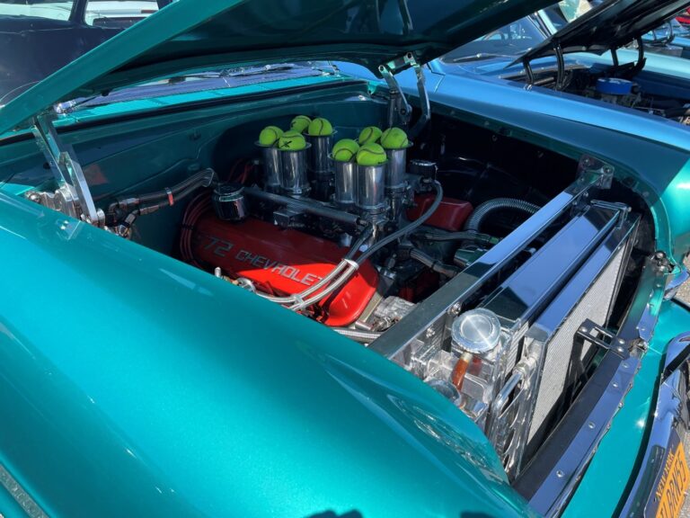 An aqua colored 1957 Chevy Belair with a Chevy big block 572 with modern tech weber fuel injection