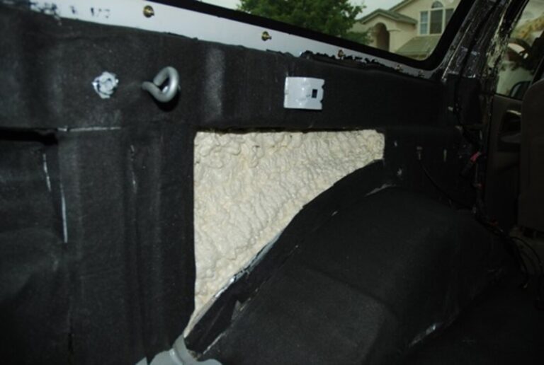 Spray onn foam car insulation installed on the side panel of a white truck bed