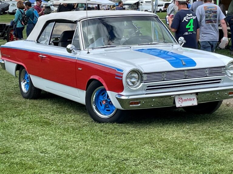 An AMC Rambler in red, white, and blue colors is considered a classic car for old car classifications