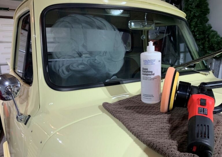 Buffing compound, rag and polishing wheel on the hood of a yellow Ford F100 in preparation to avoid common mistakes when selling a classic car