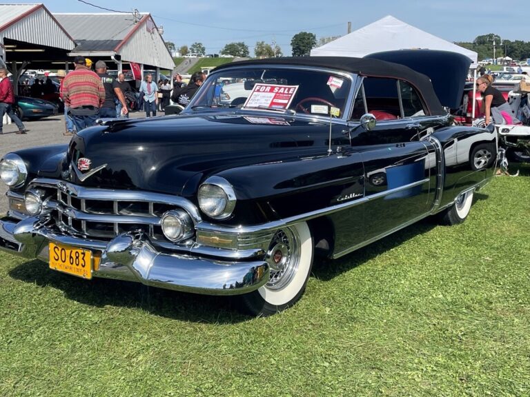 Black 50s Cadillac for sale at a car show is well prepared for a possible investment vs not worth restoring