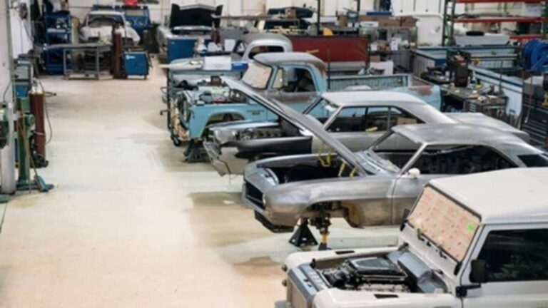 A car restoration shop with cars and trucks in various stages of restoration and having realistic expectations is important to success