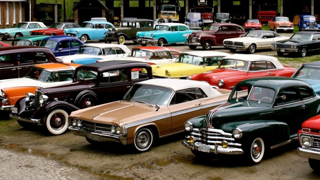 A lot full of classic cars in all colors showing the success rate of car restoration