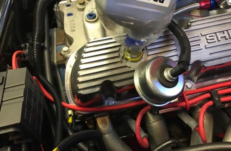 As part of regular car engine maintenance is changing the oil as noted in pouring oil into a Ford engine