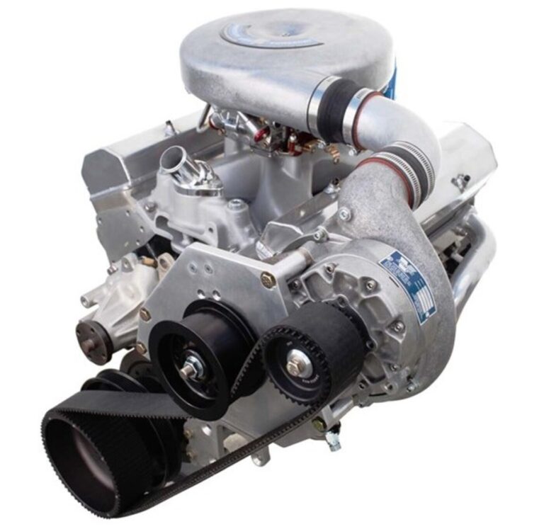 A silver centrifugal supercharger installed on a Chevy V8 engine
