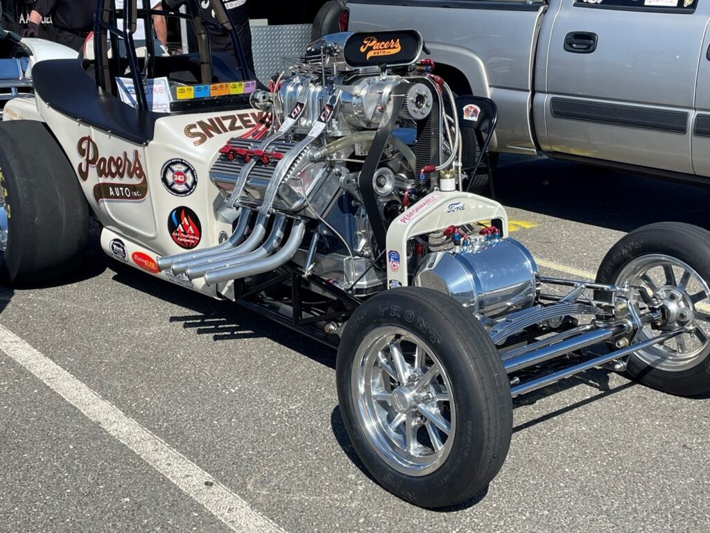 A white rail dragster with a chrome hemi engine after avoiding engine rebuilding mistakes