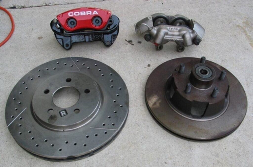 2 sets of disc brake rotor assemblies comparing drilled and slotted rotor with a standard vented rotor