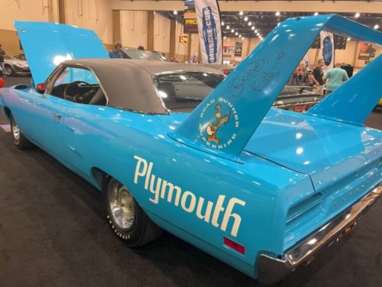 A blue 1970 Plymouth Road Runner with Richard Petty's autograph on the wing at an auction wit hthe buyer knowing the best time to buy a classic car