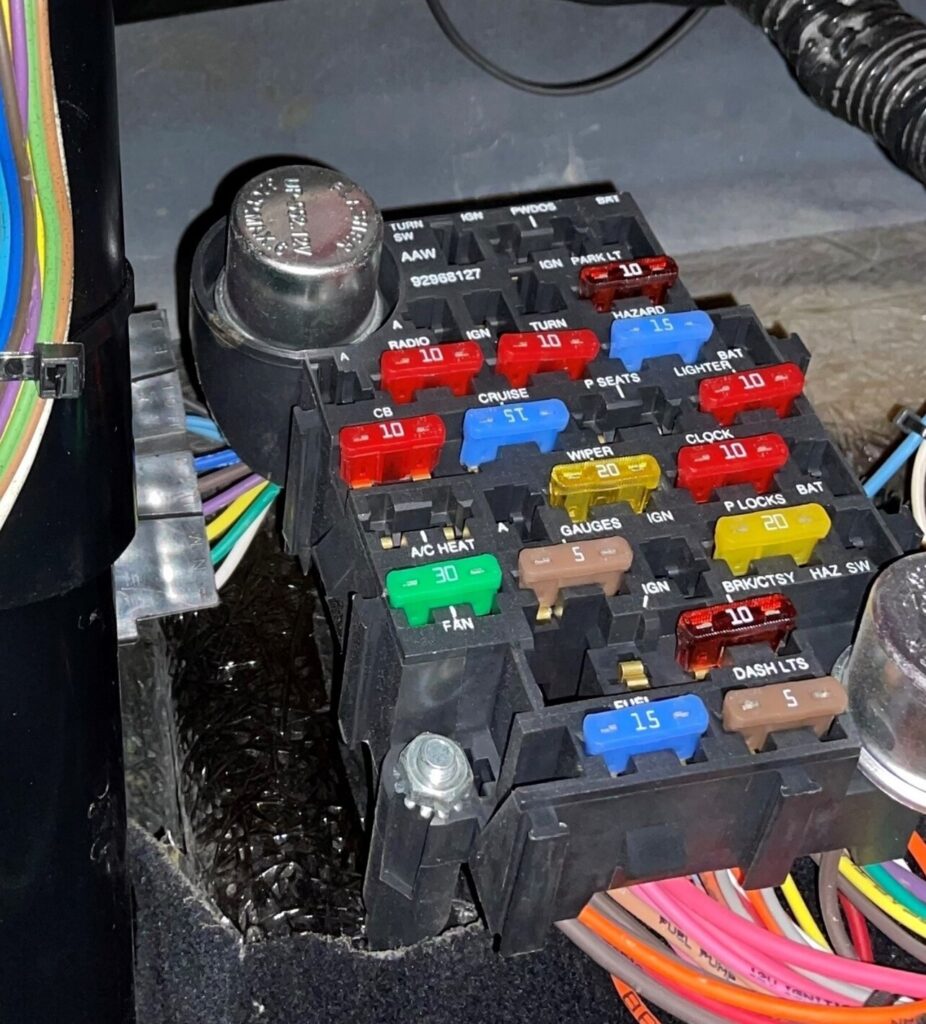 The car fuse box attached toa wire harness for removal is the start for replacing wiring