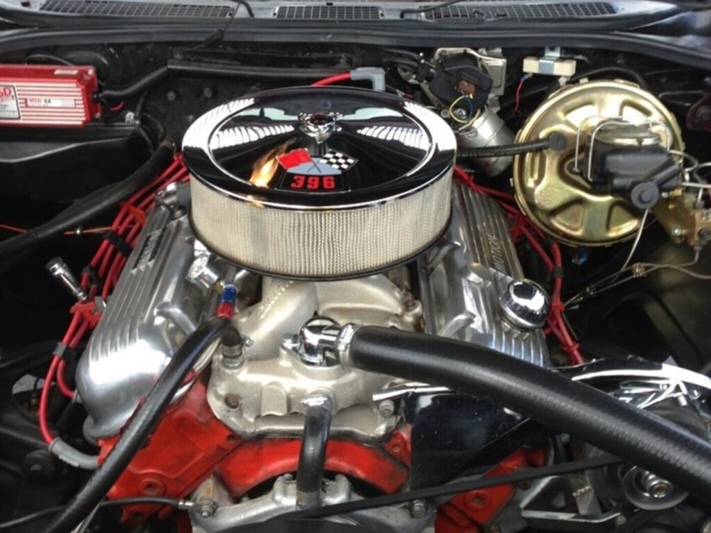 A Chevy big block 396 engine with chrome air cleaner showing the importance of maintaining a classic car engine