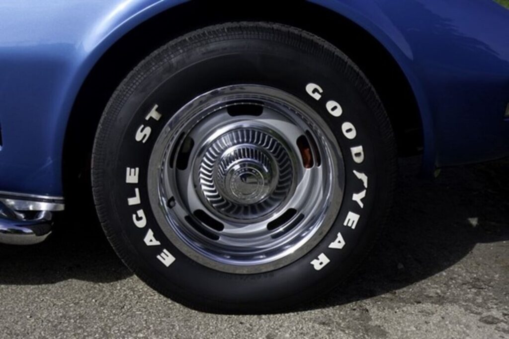 A blue Chevy Corvette with Rally Wheel and Goodyear Eagle ST tire needs to be removed for maintaining car brakes